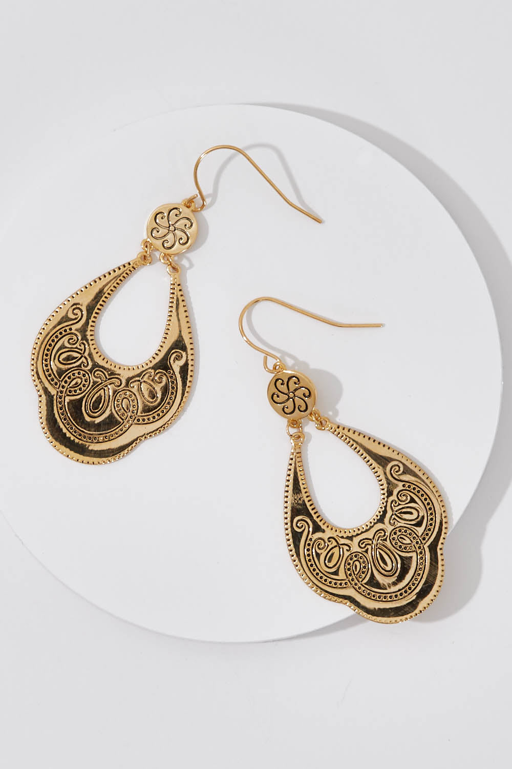 A model wearing size OneSize of the Teardrop Engraved Drop Earrings in colour Gold (Metallics), from the front, showing the whole outfit