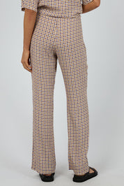 A model wearing the Harri Pants in colour Print, from the back