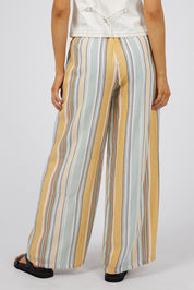 A model wearing the Cindy Pant in colour Green, from the back