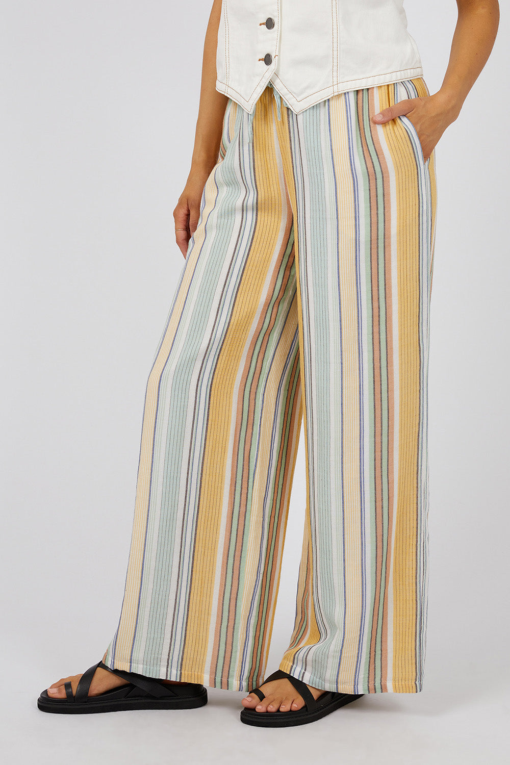 A model wearing the Cindy Pant in colour Green, from the front, cropped image