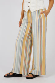 A model wearing the Cindy Pant in colour Green, from the front, cropped image
