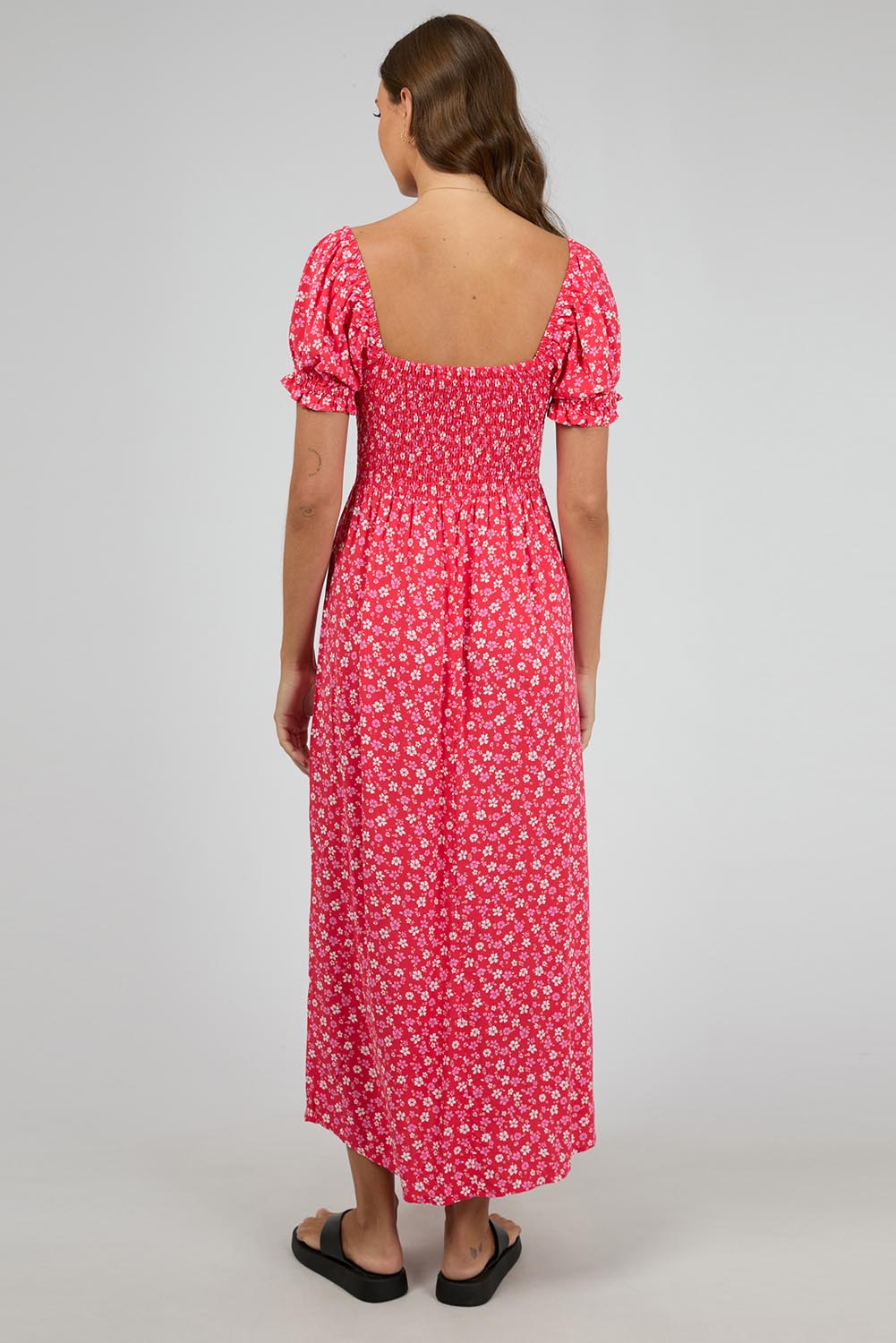 A model wearing the Dolly Maxi Dress in colour Red (Red), from the back