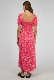 A model wearing the Dolly Maxi Dress in colour Red (Red), from the back