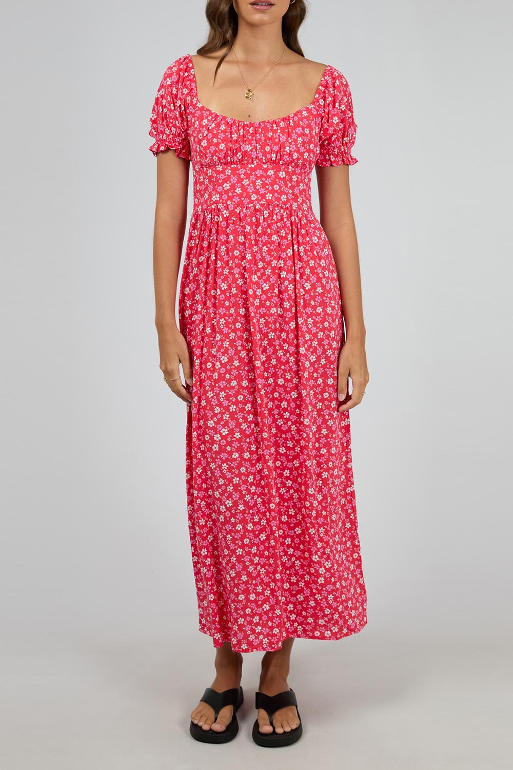 A model wearing the Dolly Maxi Dress in colour Red (Red), from the front, cropped image