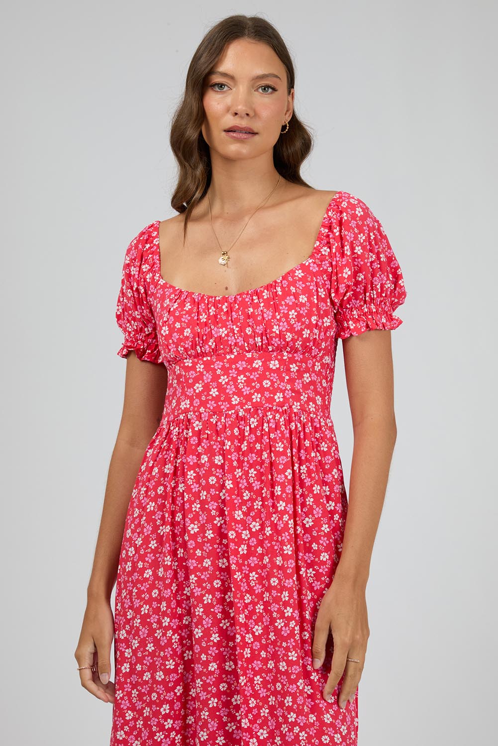 A model wearing the Dolly Maxi Dress in colour Red (Red), from the front, cropped image