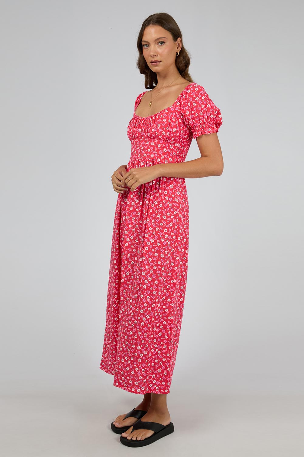 A model wearing the Dolly Maxi Dress in colour Red (Red), from the front, showing the whole outfit