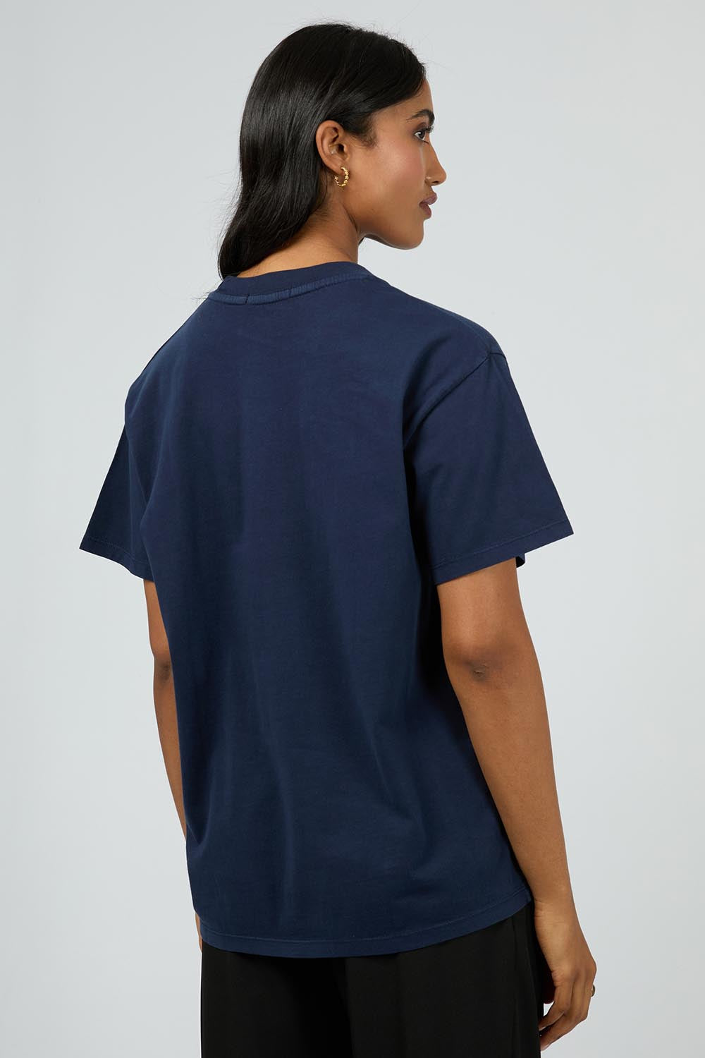 A model wearing the Manhattan Oversized Cotton Tee in colour Navy (Blue), from the back