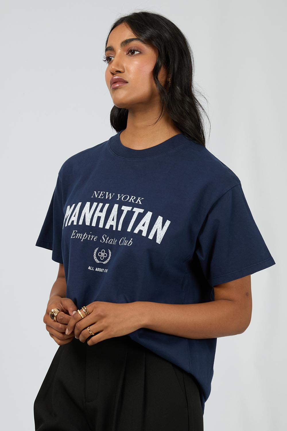 A model wearing the Manhattan Oversized Cotton Tee in colour Navy (Blue), from the front, cropped image