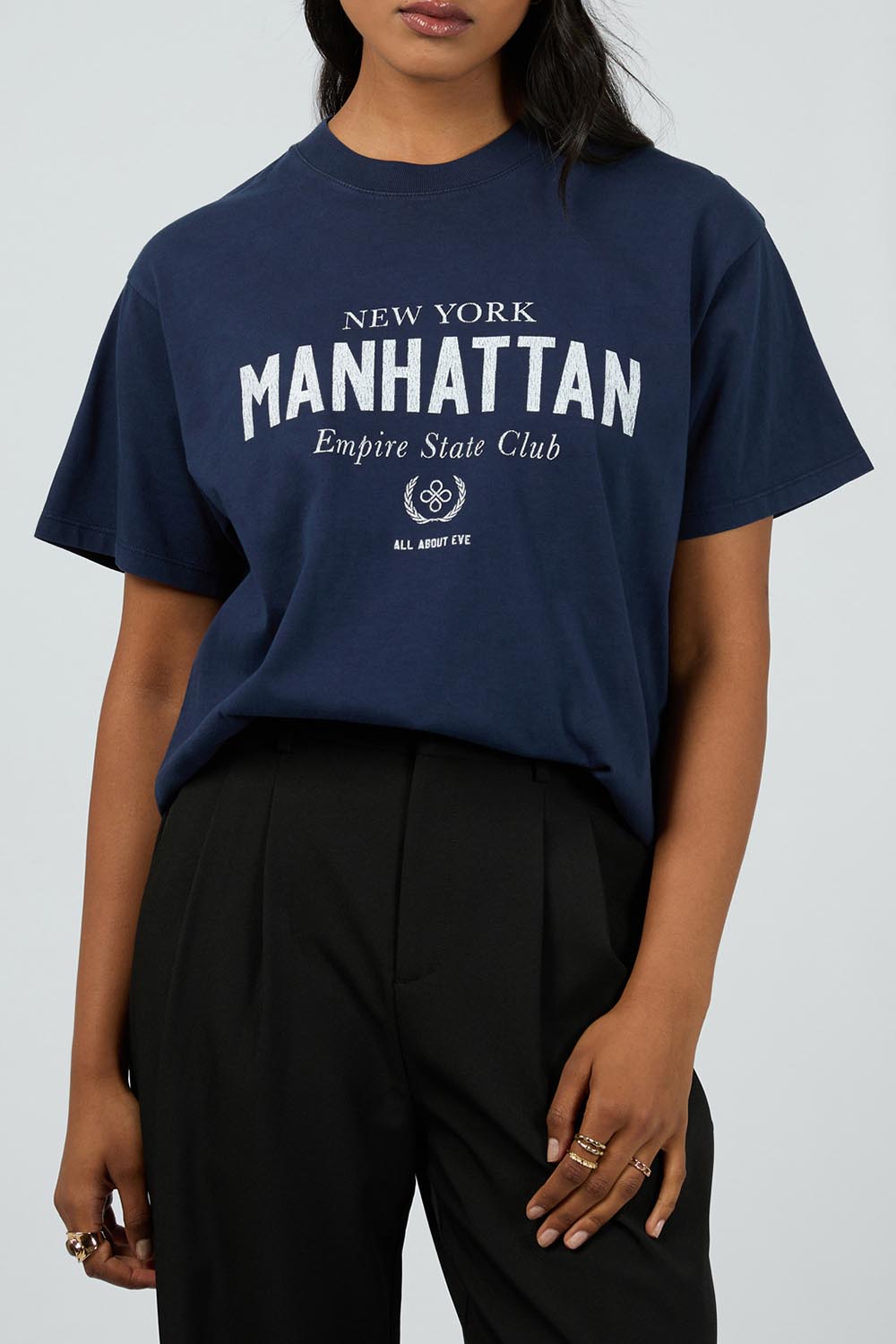 A model wearing the Manhattan Oversized Cotton Tee in colour Navy (Blue), from the front, cropped image