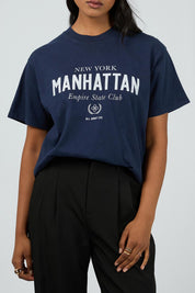 A model wearing the Manhattan Oversized Cotton Tee in colour Navy (Blue), from the front, cropped image