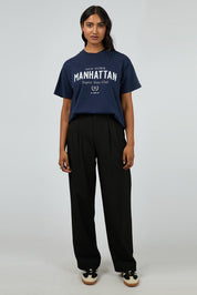 A model wearing the Manhattan Oversized Cotton Tee in colour Navy (Blue), from the front, showing the whole outfit