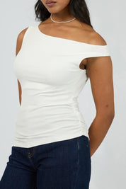 A model wearing the Kylie Off Shoulder Top in colour Vinwhite (White), from the front, cropped image