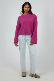 A model wearing the Cleo Knit in colour Mauve (Pink), from the front, showing the whole outfit