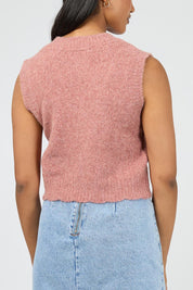 A model wearing the Leah Knit Vest in colour Quartz (Pink), from the back
