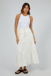 A model wearing the Coco Denim Maxi Skirt in colour Vinwhite (White), from the front, showing the whole outfit