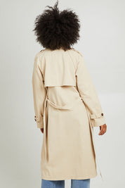 Model Olivia wearing size 10 of the Eve Trench Coat in colour Tan, from the back