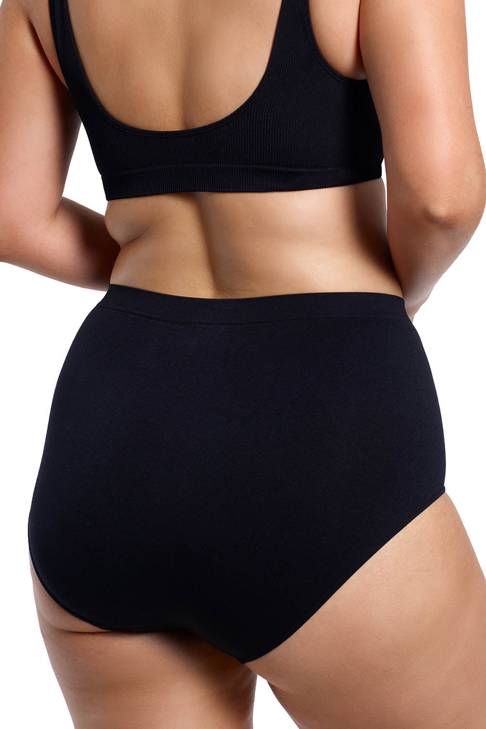 A model wearing the Curvesque Full Brief in colour Black (Black), from the back