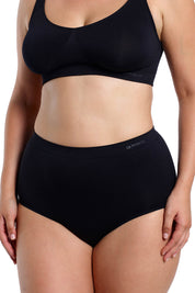 A model wearing the Curvesque Full Brief in colour Black (Black), from the front, cropped image
