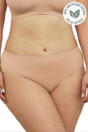 A model wearing the Bare Essentials Hi Cut Brief in colour Rosebeige, from the front, cropped image