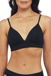 A model wearing the Bare Essentials Moulded Wirefree Bra in colour Black (Black), from the front, cropped image
