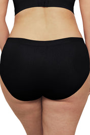 A model wearing the Bare Essentials Midi Brief in colour Black (Black), from the back
