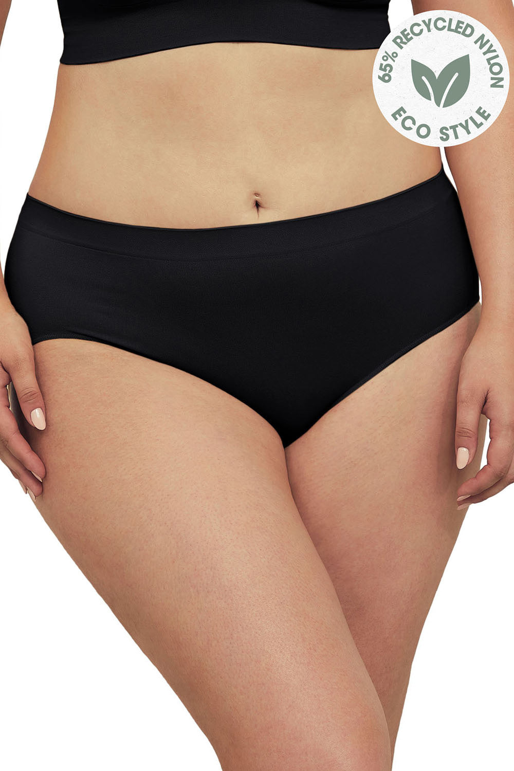 A model wearing the Bare Essentials Midi Brief in colour Black (Black), from the front, cropped image