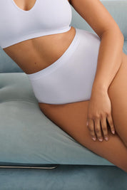 A model wearing the Pure Basics Modal Full Briefs 2 Pack in colour Aurablue (Blue), from the front, cropped image