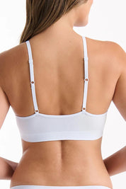 A model wearing the Pure Basics Triangle Modal Bralette in colour Aurablue (Blue), from the back