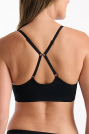 A model wearing the Pure Basics Triangle Modal Bralette in colour Black (Black), from the back