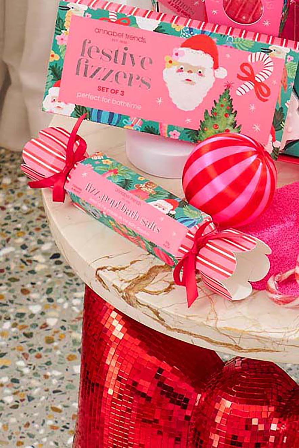 Product shot of the Festive Fizz Pop Bath Salts Bon Bon - Festive in colour Festive, from the front