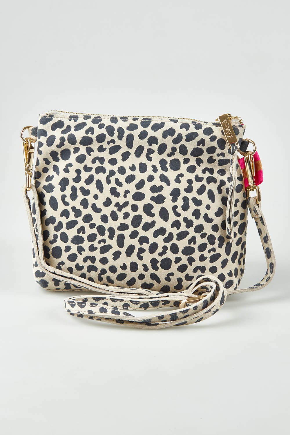 A model wearing size OneSize of the Alexis Leather Crossbody in colour Spotsuede, from the front, showing the whole outfit