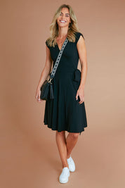 Model Alice wearing size S of the Wrap Dress in colour Black (Black), from the front, showing the whole outfit