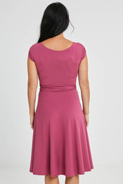 Model Katie wearing size S of the Wrap Dress in colour Dryrose (Pink), from the back