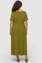 A model wearing the Mila Maxi Dress in colour Cardamom (Green), from the front, cropped image
