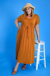 Model Caitlin wearing size 3XL of the Mila Maxi Dress in colour Tumeric, from the front, showing the whole outfit