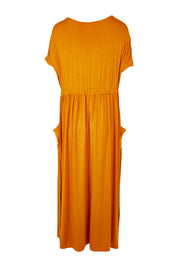 Product shot of the Mila Maxi Dress in colour Tumeric, from the back