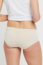 A model wearing the Bamboo Hipster Brief in colour Nude, from the back