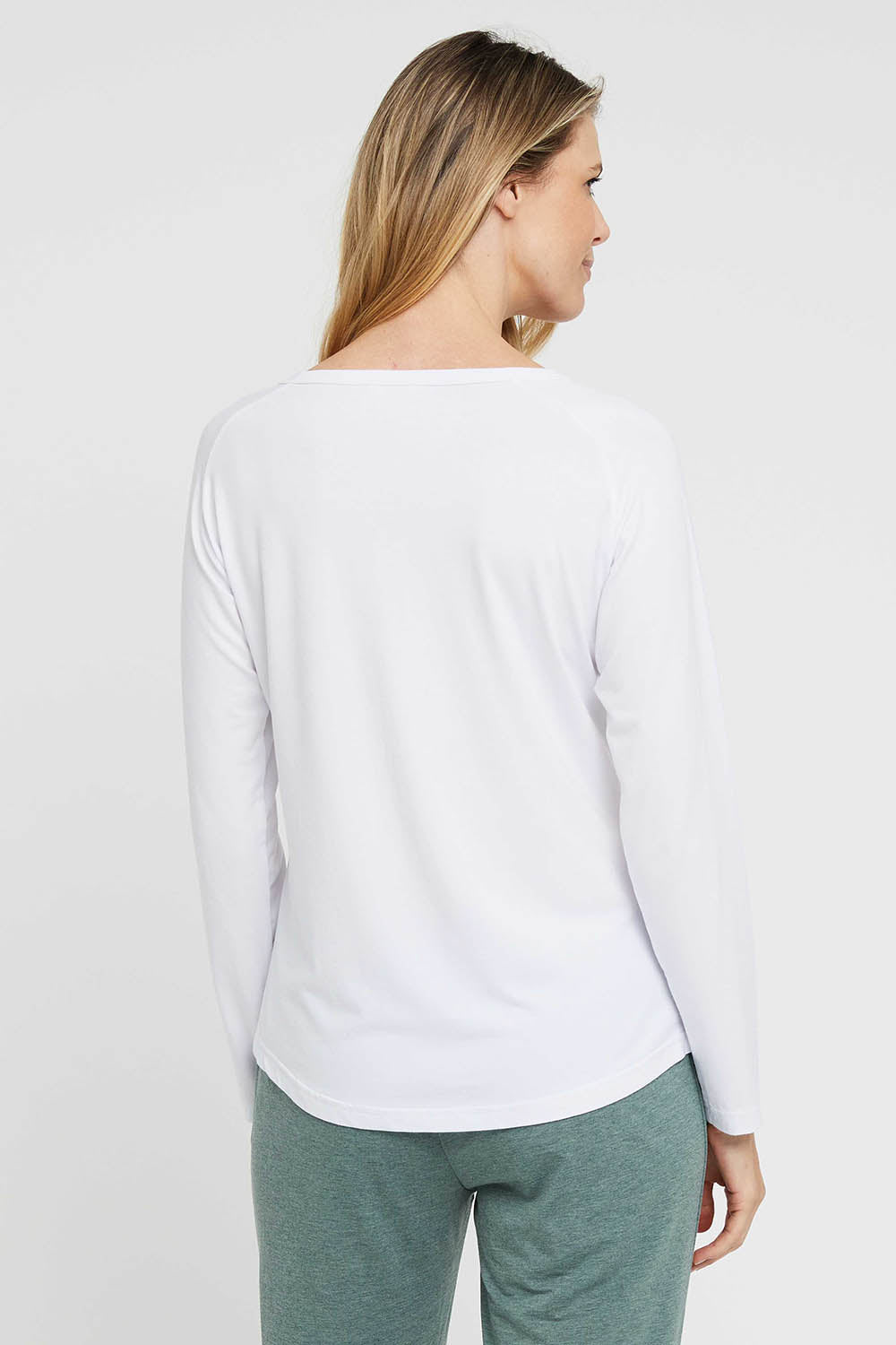A model wearing the Henley Long Sleeve Bamboo Top in colour White (White), from the back