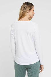 A model wearing the Henley Long Sleeve Bamboo Top in colour White (White), from the back