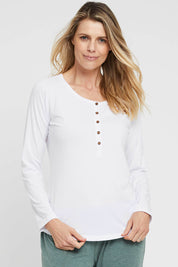 A model wearing the Henley Long Sleeve Bamboo Top in colour White (White), from the front, cropped image