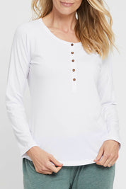 A model wearing the Henley Long Sleeve Bamboo Top in colour White (White), from the front, cropped image