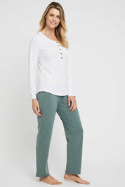 A model wearing the Henley Long Sleeve Bamboo Top in colour White (White), from the front, showing the whole outfit