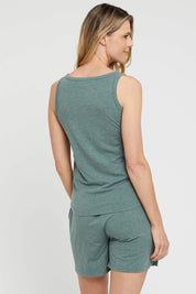 A model wearing the Bamboo Shorts in colour Moss (Green), from the back