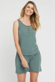 A model wearing the Bamboo Shorts in colour Moss (Green), from the front, cropped image