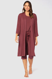 A model wearing the Bamboo Robe in colour Burgundy (Red), from the front, showing the whole outfit