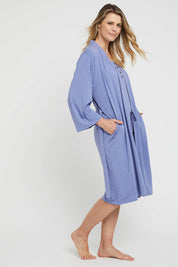 A model wearing the Bamboo Robe in colour Lavender (Blue), from the front, showing the whole outfit