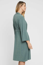 A model wearing the Bamboo Robe in colour Moss (Green), from the back