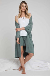 A model wearing the Bamboo Robe in colour Moss (Green), from the front, showing the whole outfit