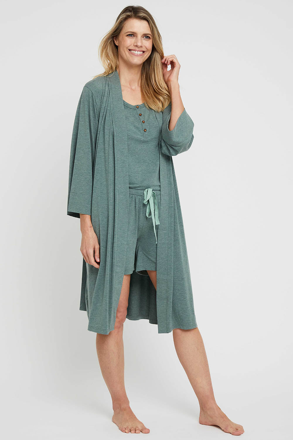A model wearing the Bamboo Robe in colour Moss (Green), from the front, showing the whole outfit