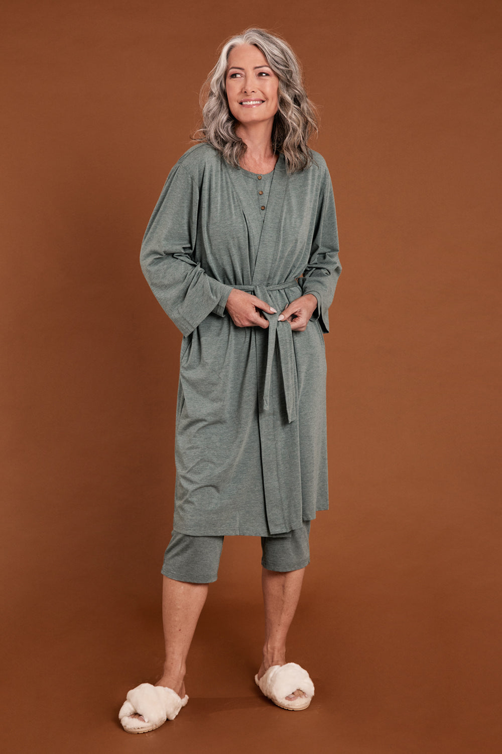 Model Luisa wearing size S of the Bamboo Robe in colour Moss (Green), from the front, showing the whole outfit